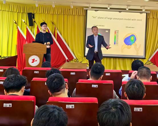 A person standing in front of a podium with a crowd of people in the background

Description automatically generated